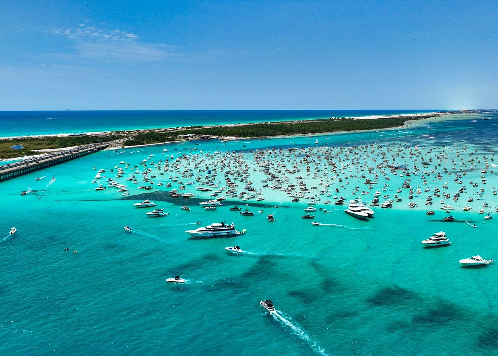 Boats anchored at a turquoise Miami sandbar